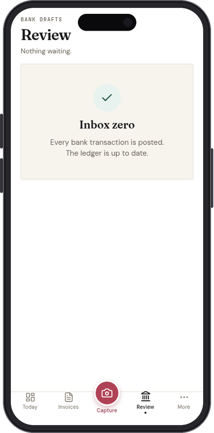 The Review tab in the IQ Books app showing inbox zero: every bank transaction posted